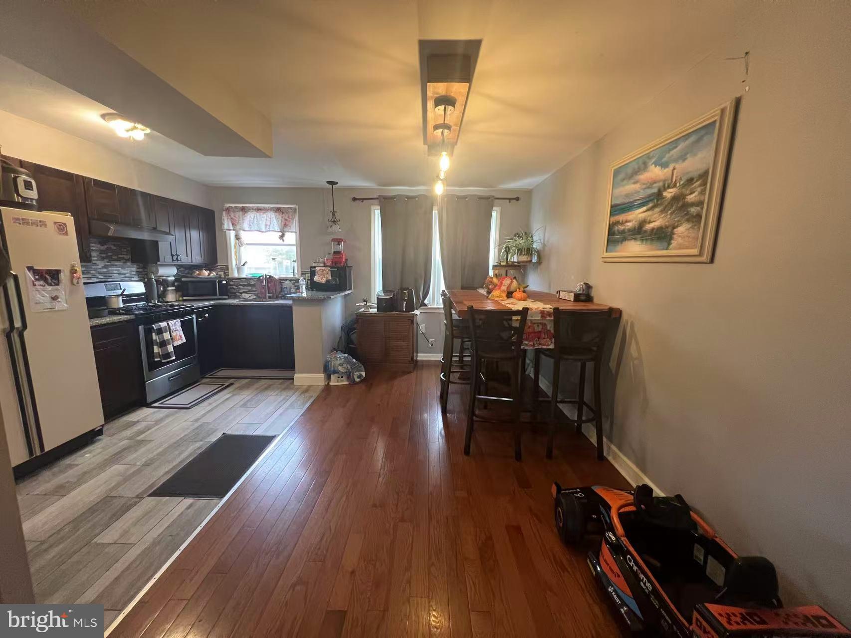 3147 Friendship Street Philadelphia, PA 19149 - Photo 5 of 16 a view of a dining room with furniture window and wooden floor