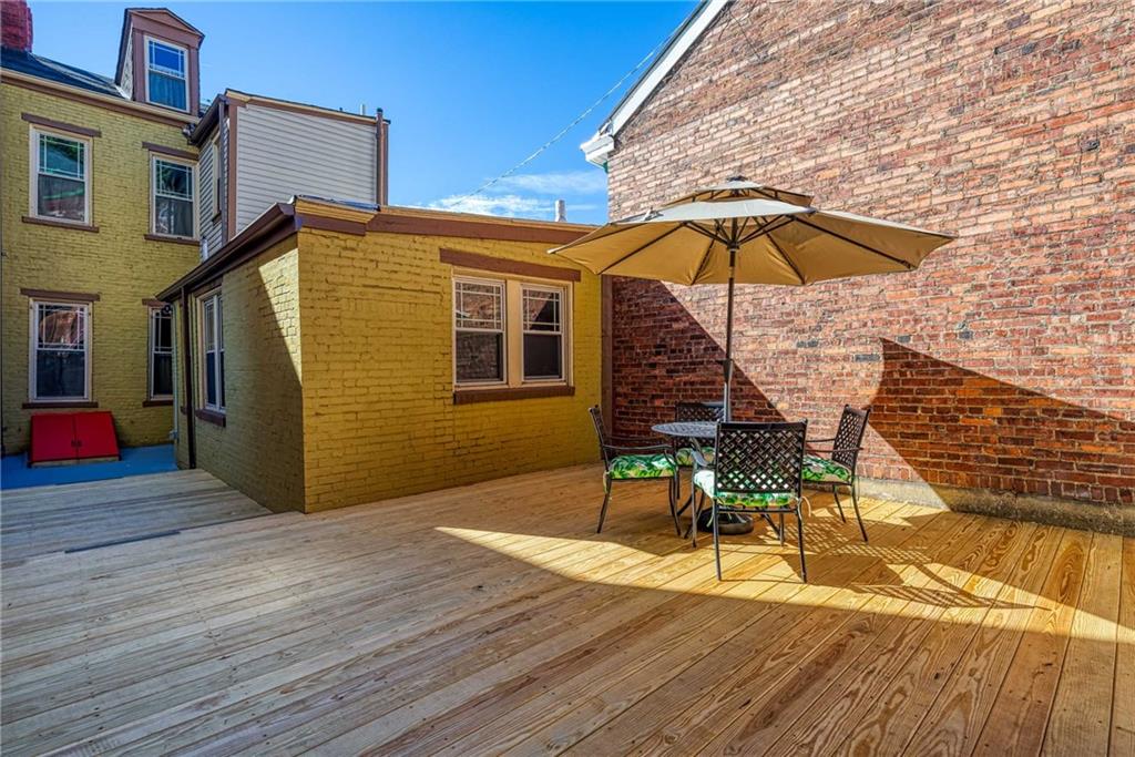 838 Spring Garden Avenue Pittsburgh, PA 15212 - Photo 22 of 24 a view of a house with backyard and sitting area