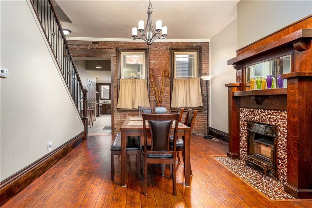 838 Spring Garden Avenue Pittsburgh, PA 15212 - Photo 4 of 24 a view of a livingroom with furniture window and wooden floor
