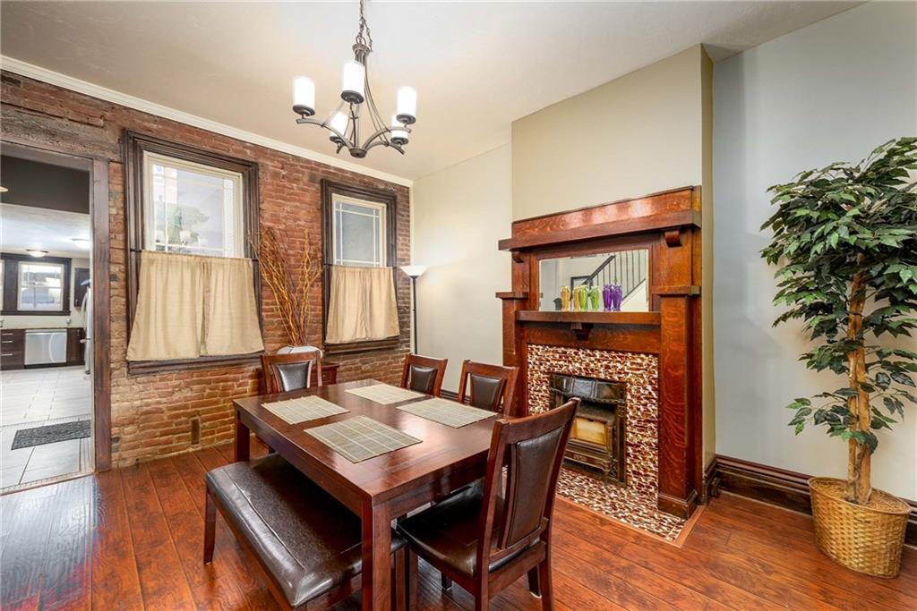 838 Spring Garden Avenue Pittsburgh, PA 15212 - Photo 5 of 24 a view of a dining room with furniture window and wooden floor
