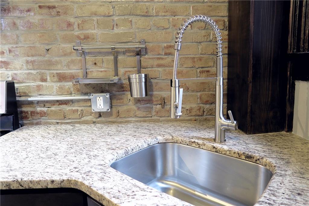 838 Spring Garden Avenue Pittsburgh, PA 15212 - Photo 9 of 24 a kitchen with granite countertop a sink and granite top