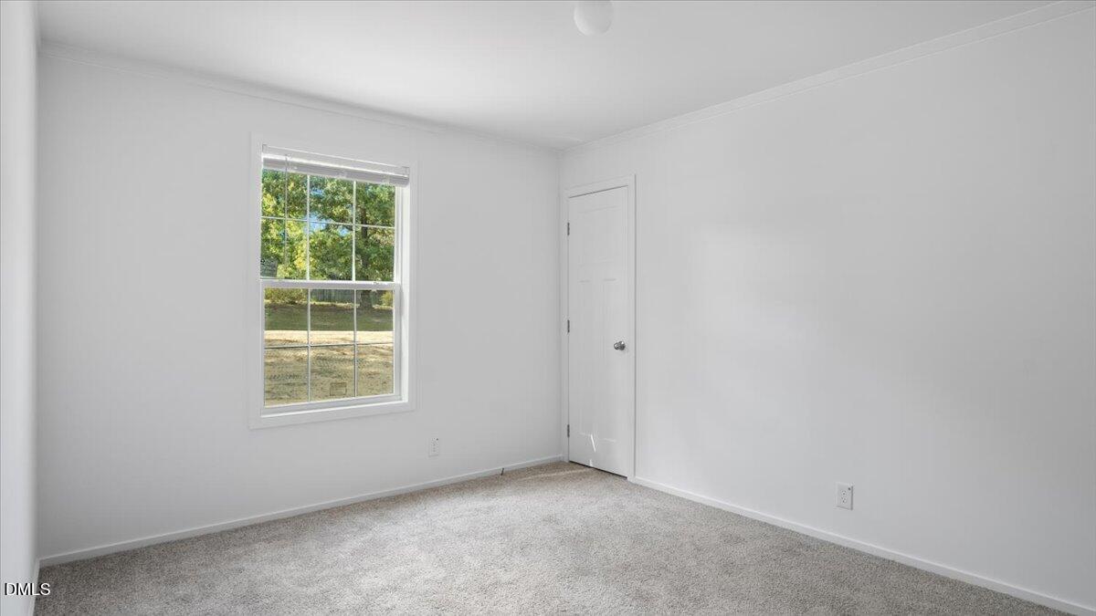 212 Ellington's Path Henderson, NC 27537 - Photo 17 of 36 an empty room with windows