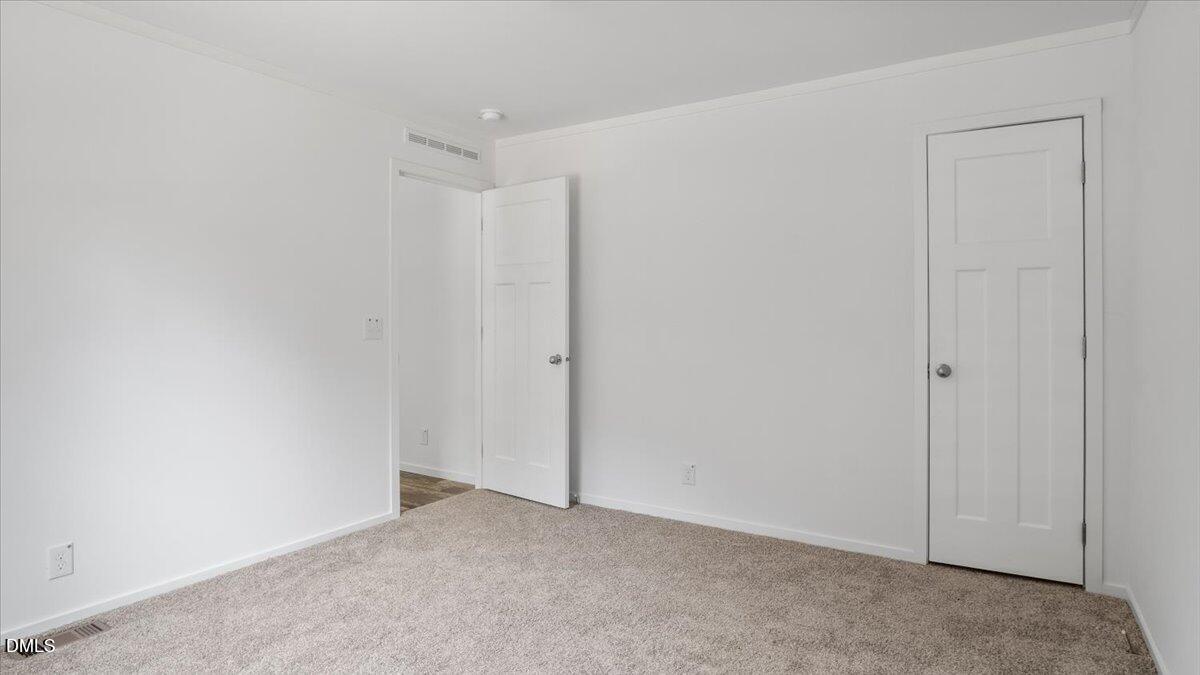 212 Ellington's Path Henderson, NC 27537 - Photo 18 of 36 a view of an empty room