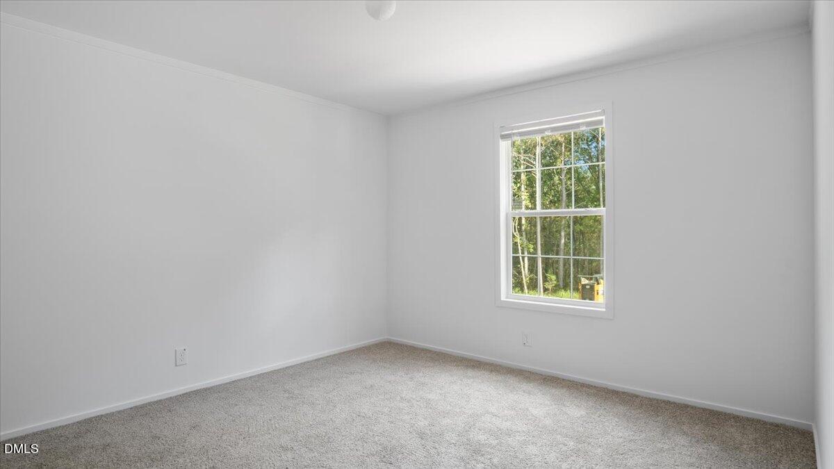 212 Ellington's Path Henderson, NC 27537 - Photo 20 of 36 an empty room with a window