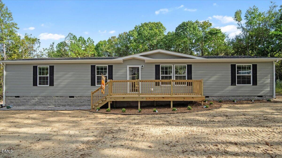 212 Ellington's Path Henderson, NC 27537 - Photo 28 of 36 a front view of a house with a yard