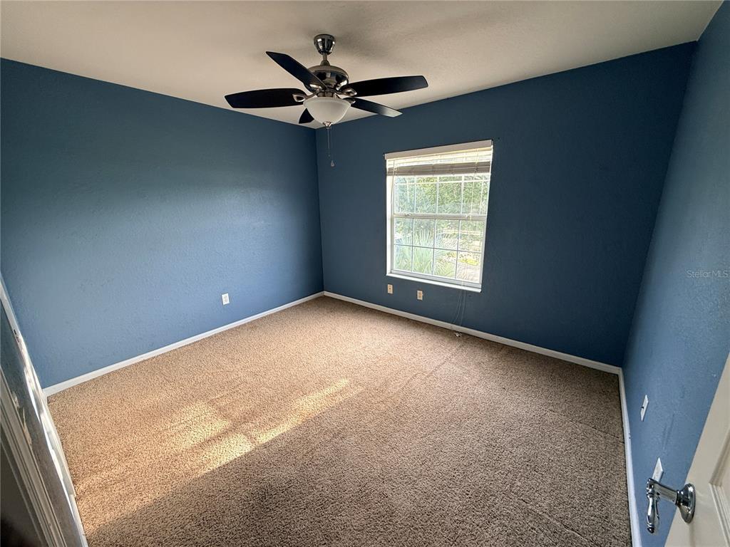 4199 Southwest 46th Court Ocala, FL 34474 - Photo 33 of 50 an empty room with a window and a fan