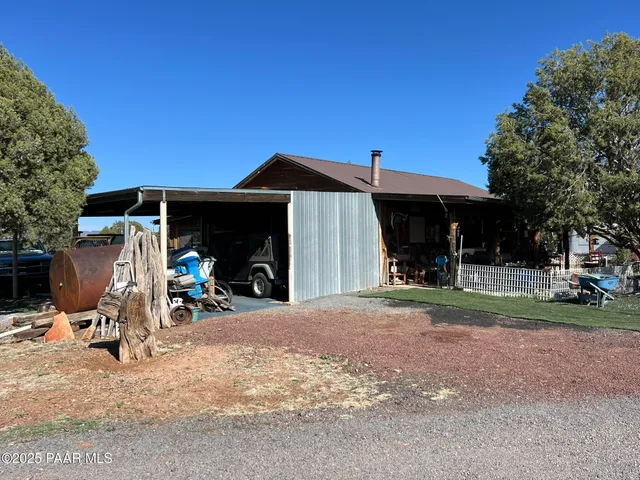 a view of a car park in front of house