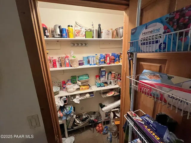 a room with furniture and a book shelf