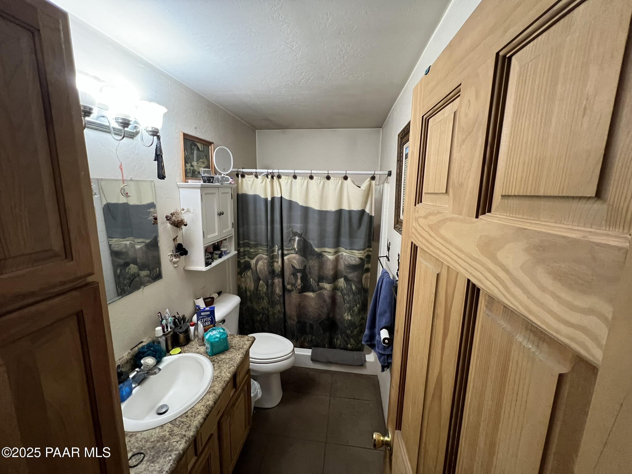 314 Bullock Road Ash Fork, AZ 86320 - Photo 7 of 33 a bathroom with a granite countertop sink toilet and shower