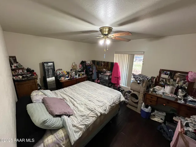 a bed room with a bed furniture and a chandelier