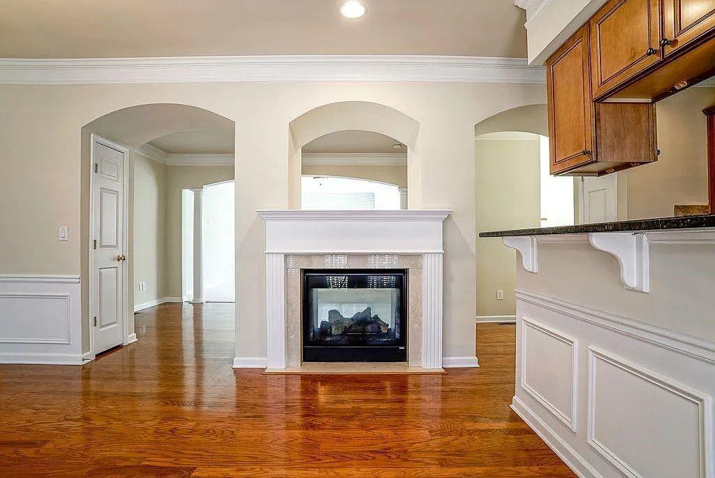 6120 Joybrook Road Duluth, GA 30097 - Photo 10 of 30 a living room with furniture and a fireplace
