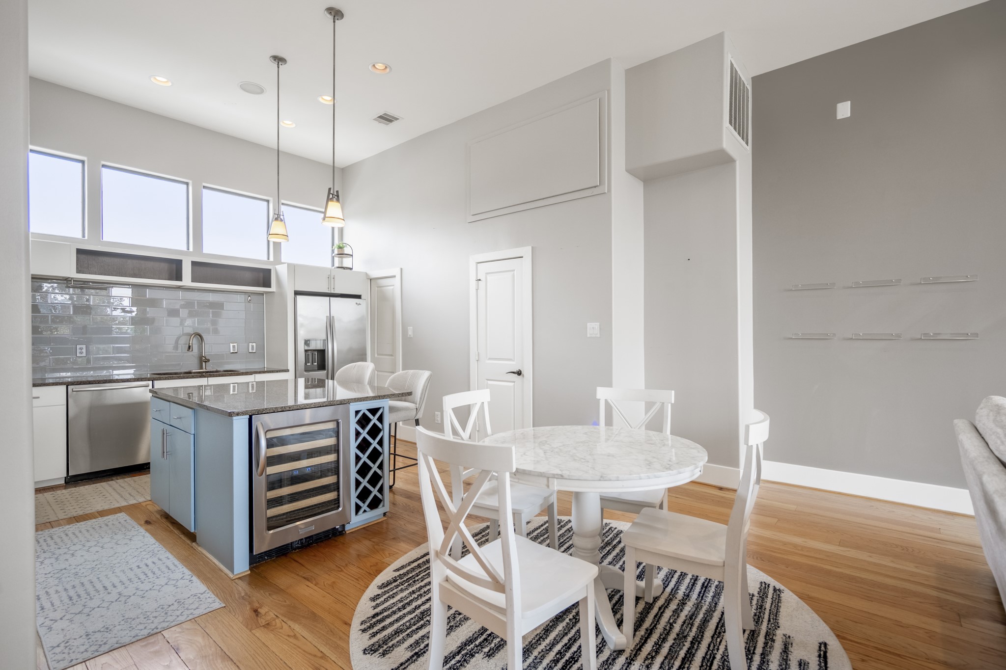 1310 West Dallas Street Houston, TX 77019 - Photo 12 of 50 a kitchen with a table chairs stove and wooden floor