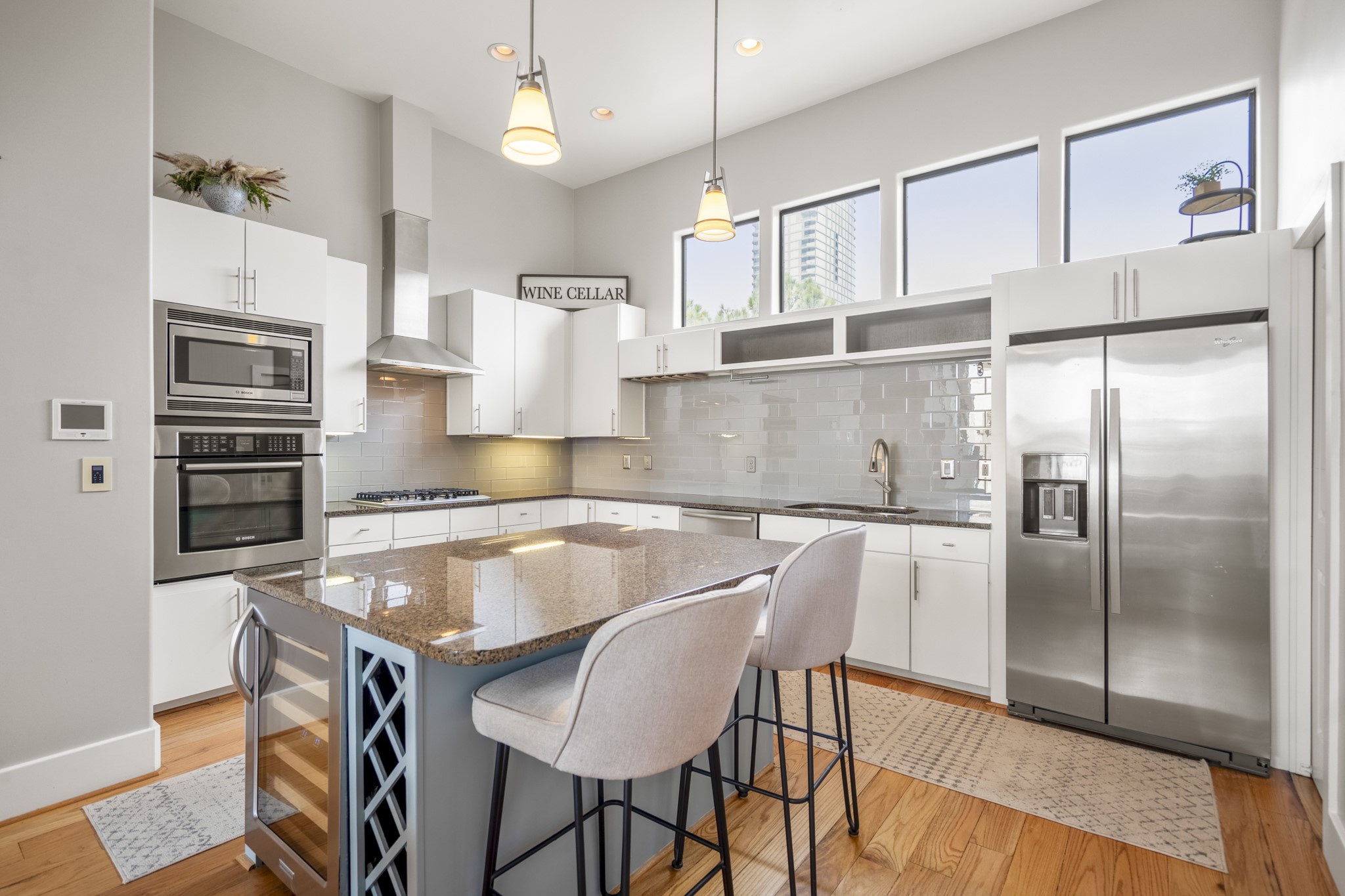 1310 West Dallas Street Houston, TX 77019 - Photo 14 of 50 a kitchen with a table chairs refrigerator and microwave