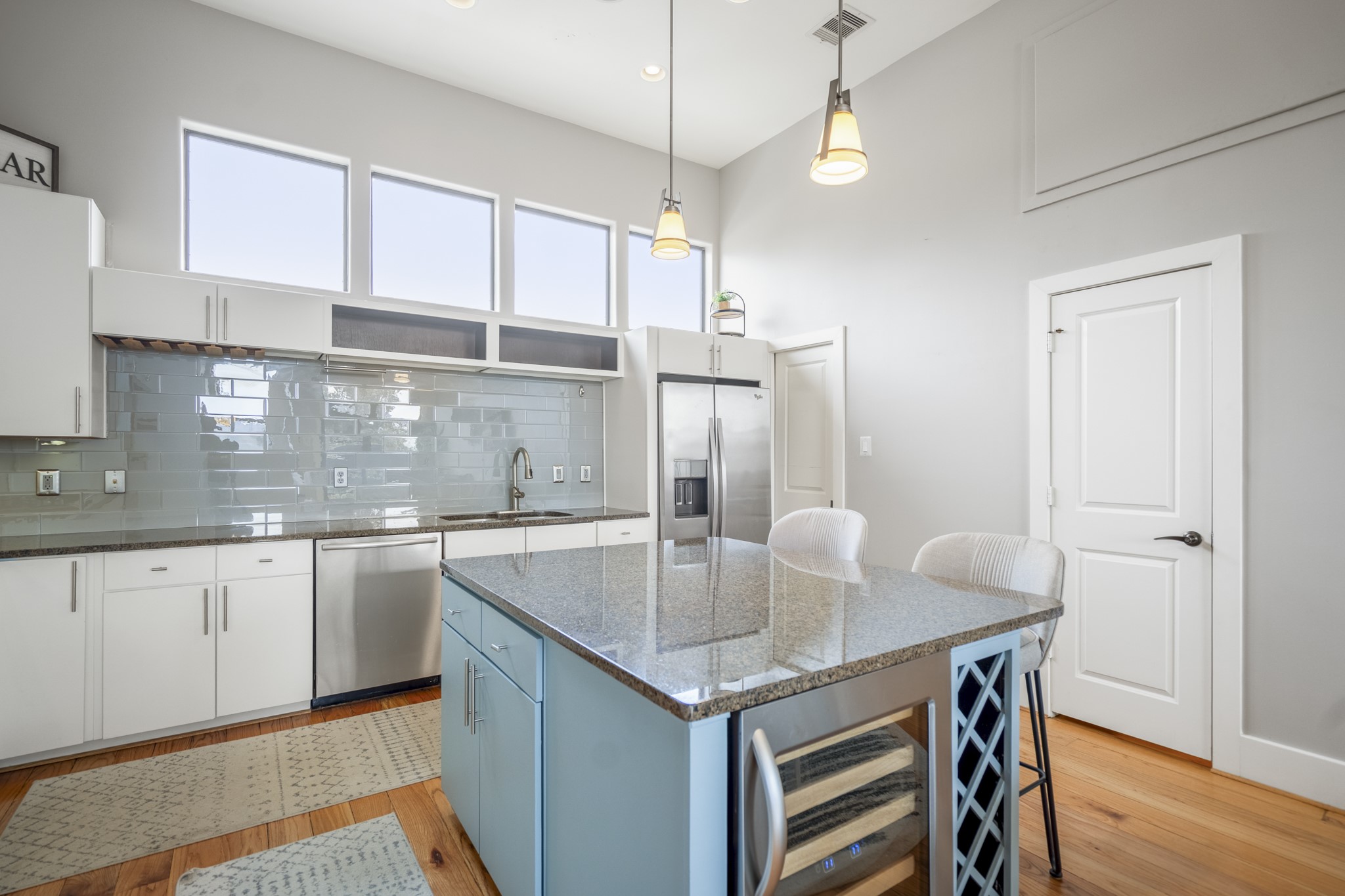1310 West Dallas Street Houston, TX 77019 - Photo 16 of 50 a kitchen with kitchen island a sink table and chairs