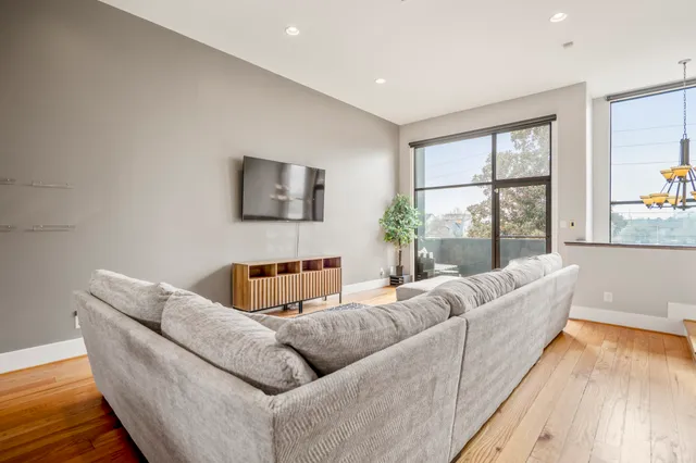 a view of a balcony with wooden floor