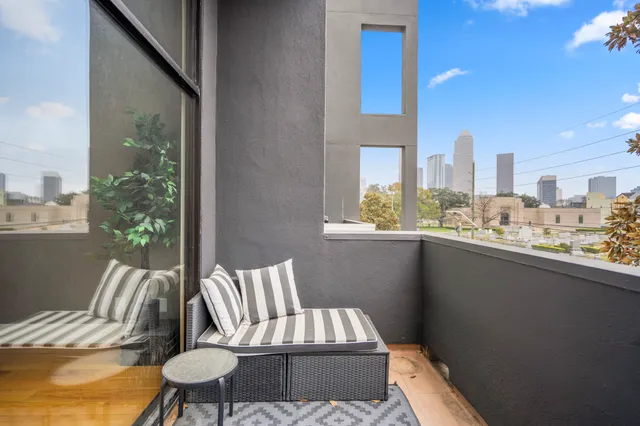 a view of a living room and a balcony