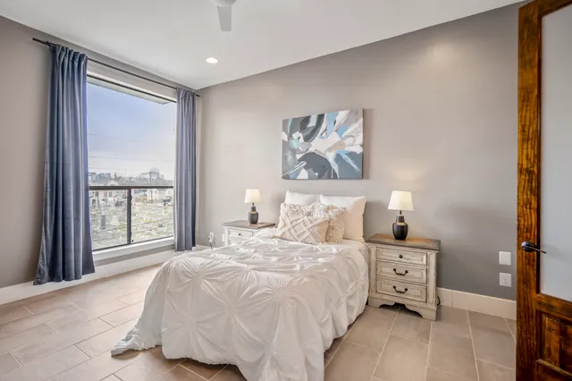 a bedroom with a bed and a dresser