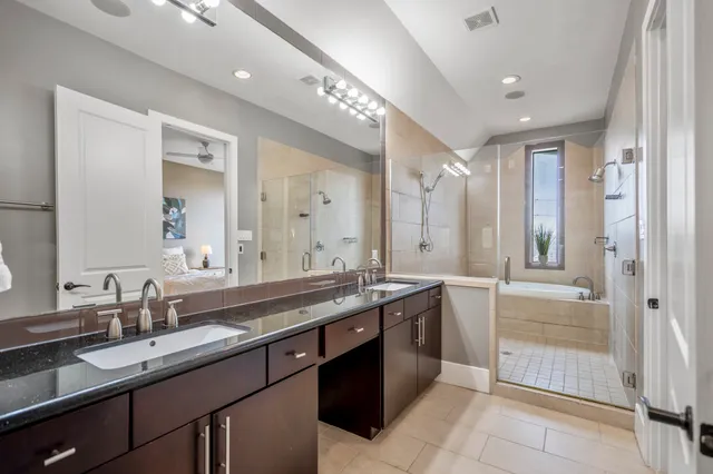 a bathroom with a bathtub and shower