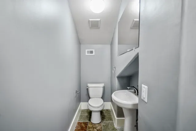 a bathroom with a glass shower door