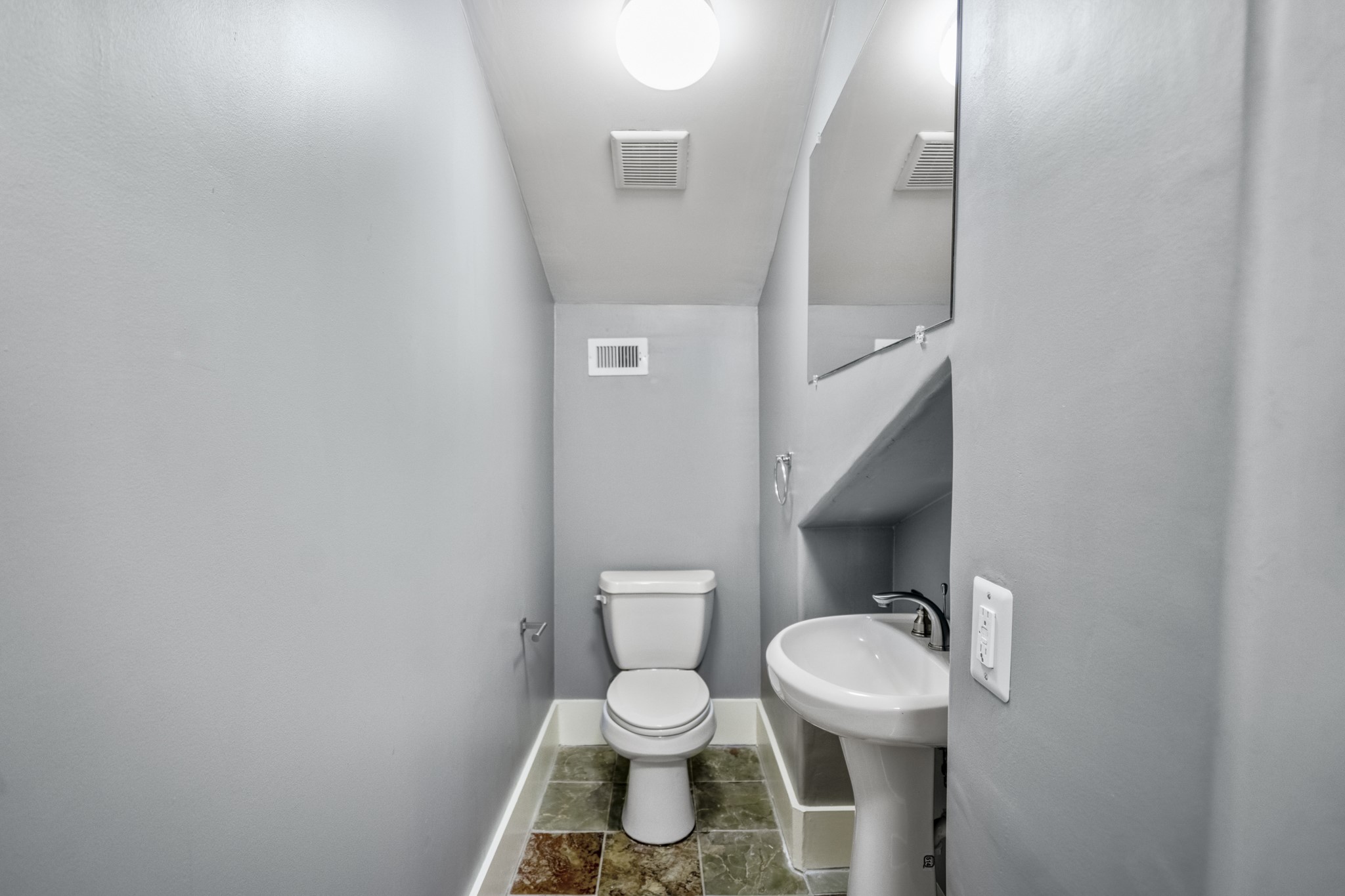 1310 West Dallas Street Houston, TX 77019 - Photo 41 of 50 a white toilet sitting next to a bathroom sink