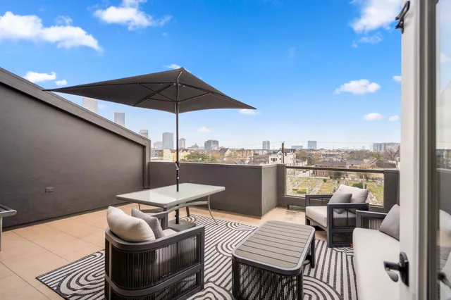 a view of a terrace with sitting area