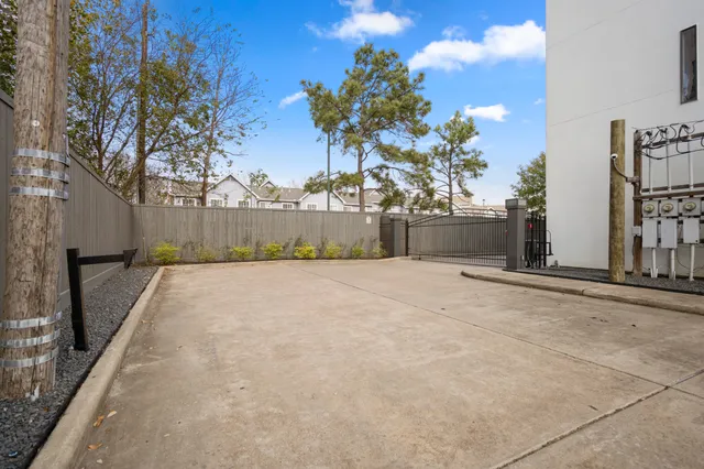 a front view of residential houses with yard and green space