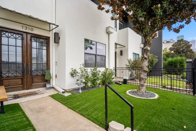 a view of a house with a yard and a garden