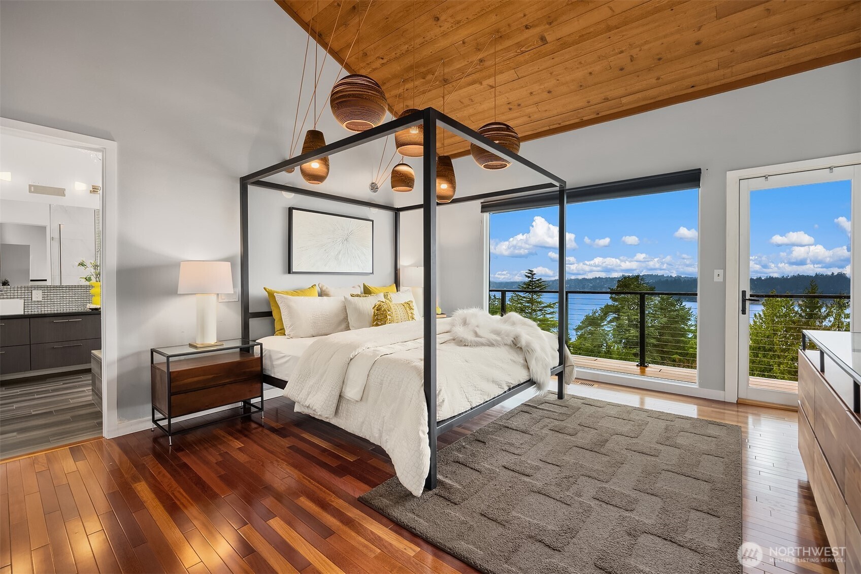 5340 West Mercer Way Mercer Island, WA 98040 - Photo 18 of 36 a bed room with a bed and a view of bedroom