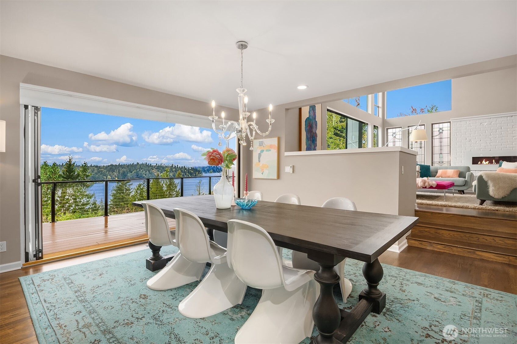 5340 West Mercer Way Mercer Island, WA 98040 - Photo 2 of 36 a view of a dining room with furniture wooden floor and chandelier