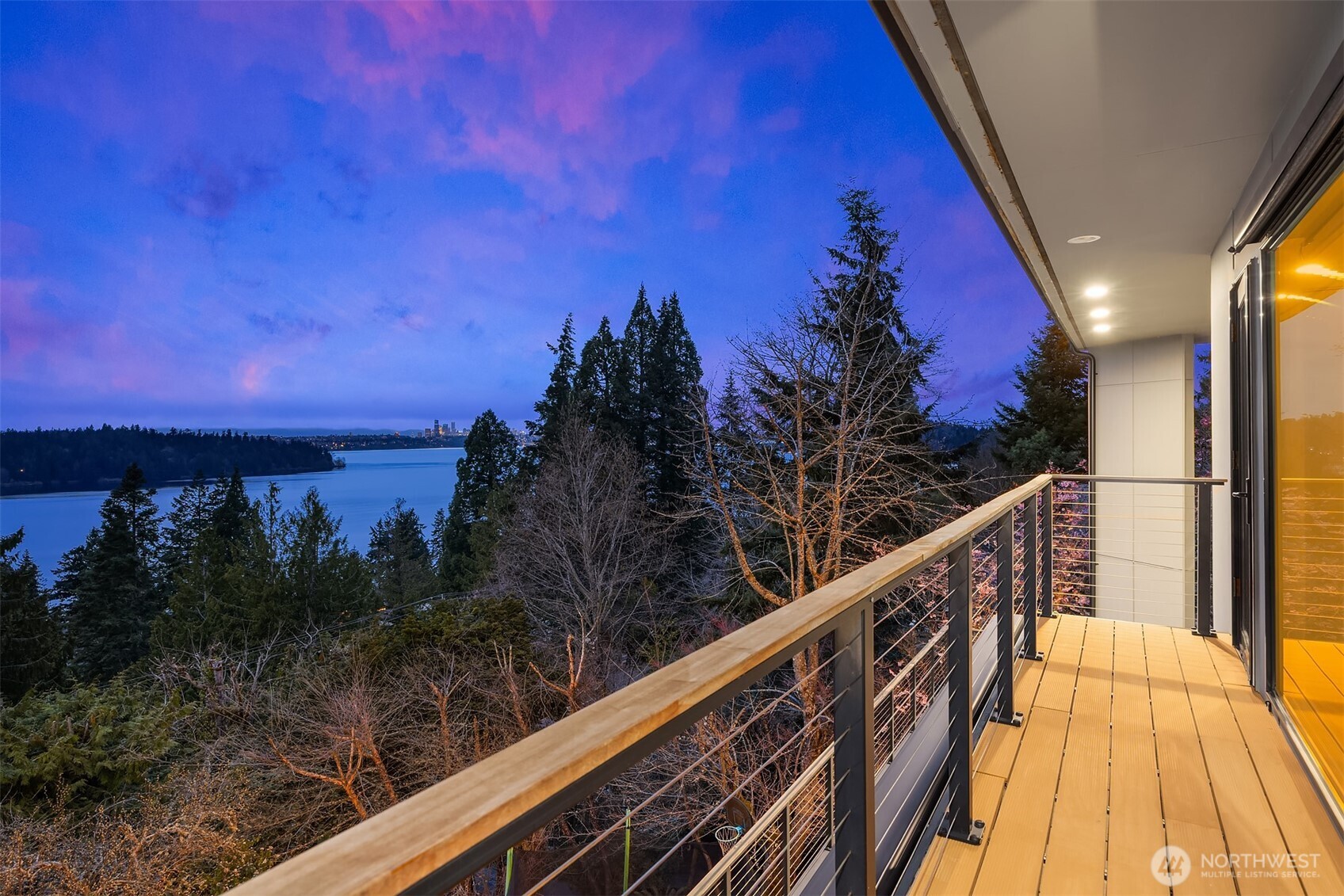 5340 West Mercer Way Mercer Island, WA 98040 - Photo 21 of 36 a view of balcony with wooden floor and a potted plant