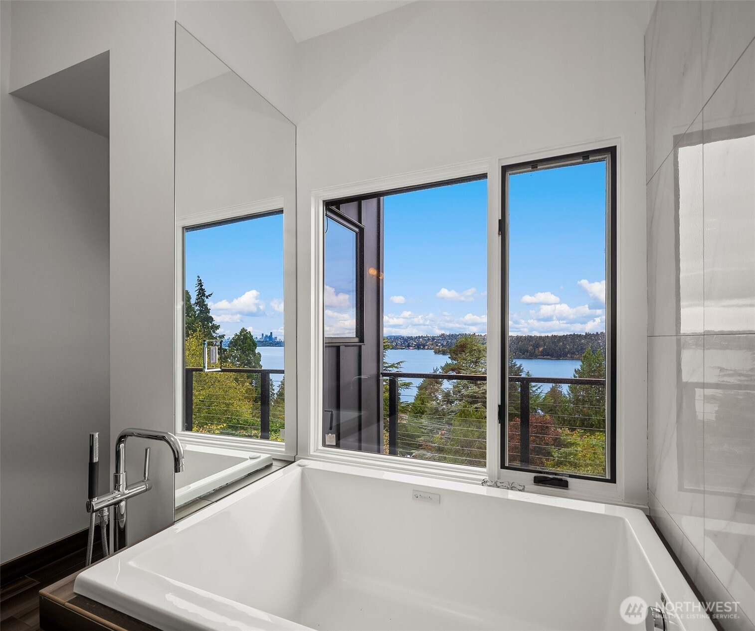 5340 West Mercer Way Mercer Island, WA 98040 - Photo 24 of 36 a view of a bathroom with a tub and windows