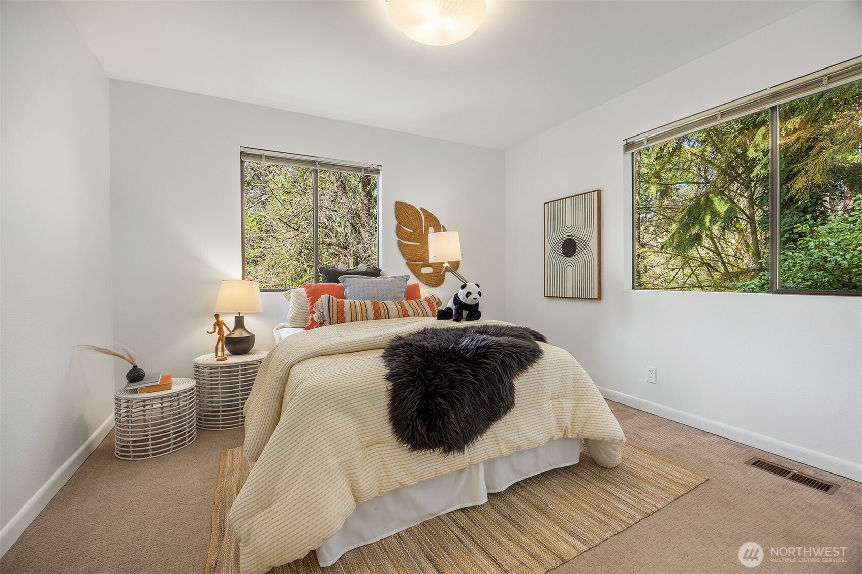 5340 West Mercer Way Mercer Island, WA 98040 - Photo 27 of 36 a bedroom with a bed lamp and a large window with outer view