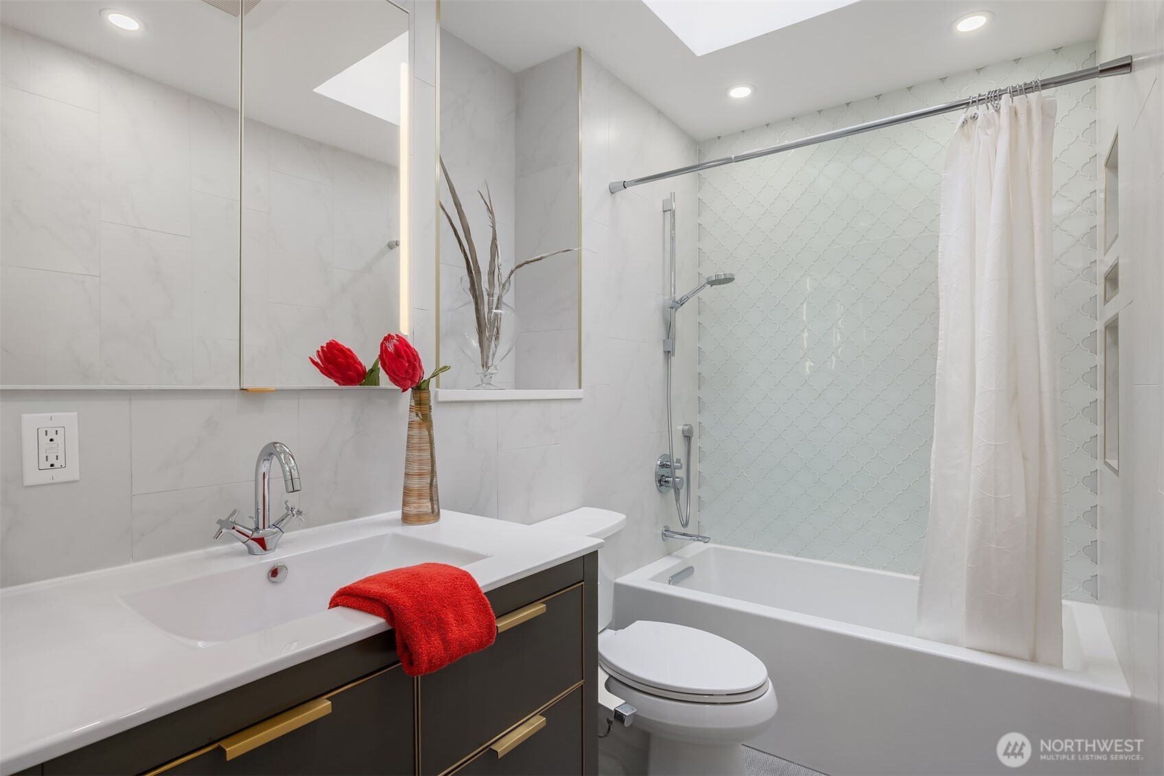 5340 West Mercer Way Mercer Island, WA 98040 - Photo 29 of 36 a bathroom with a sink toilet vanity and shower