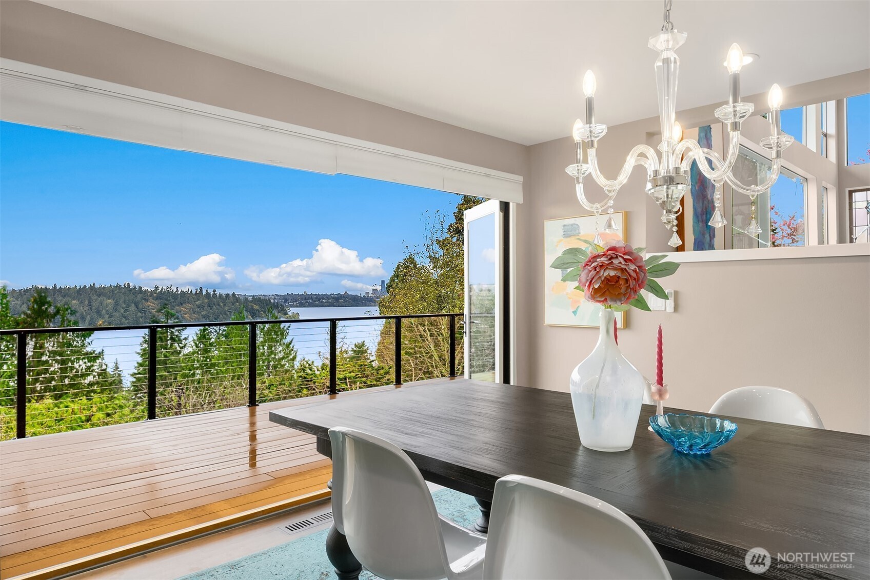 5340 West Mercer Way Mercer Island, WA 98040 - Photo 8 of 36 a view of a dining room with furniture a chandelier and wooden floor