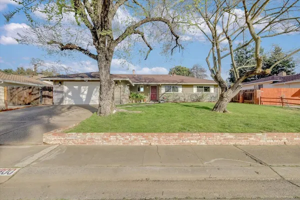 a view of house with yard