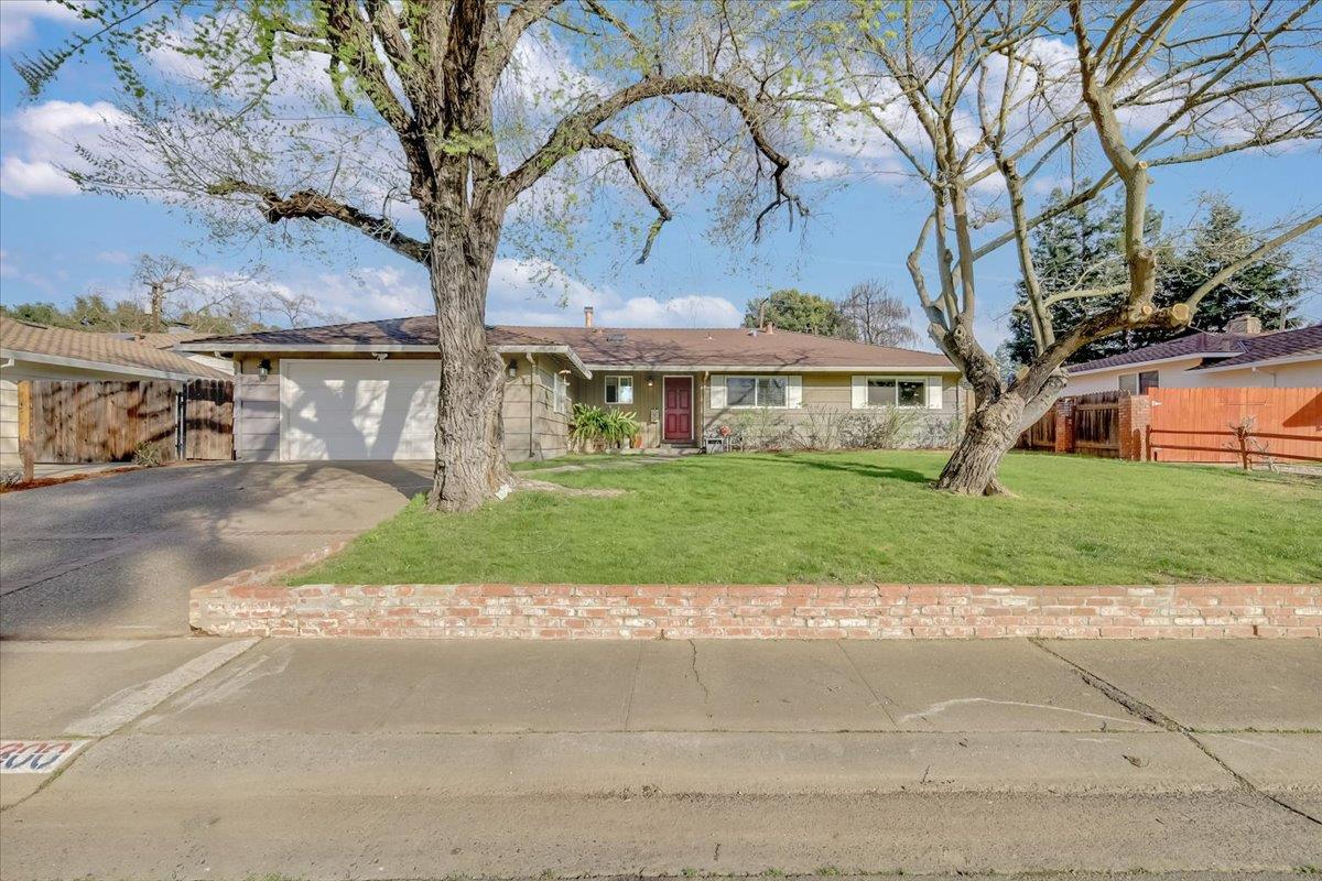 a view of house with yard