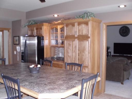 4174 River Ridge Sandwich, IL 60548 - Photo 5 of 16 a kitchen with stainless steel appliances granite countertop a refrigerator a oven a sink with a dining table and chairs