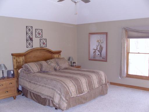 4174 River Ridge Sandwich, IL 60548 - Photo 8 of 16 a bedroom with a bed and a window