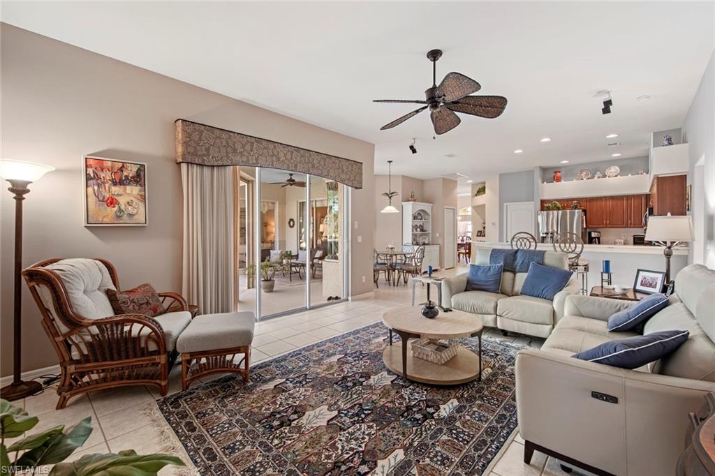 21516 Langholm Run Estero, FL 33928 - Photo 16 of 50 a living room with furniture and a large window