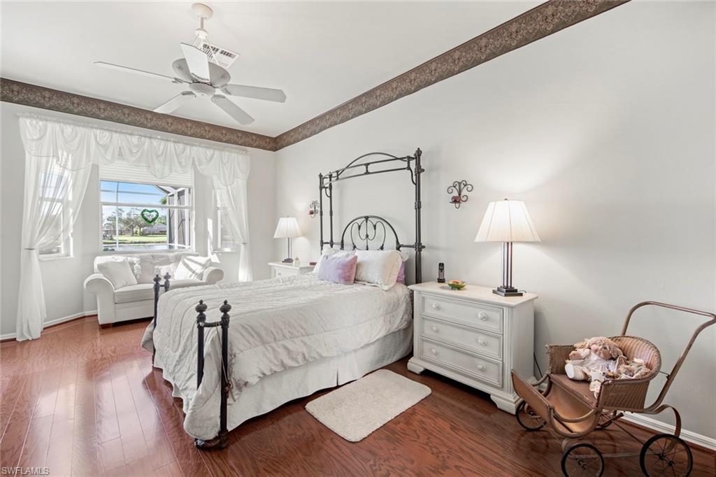 21516 Langholm Run Estero, FL 33928 - Photo 17 of 50 a bedroom with a bed and a window