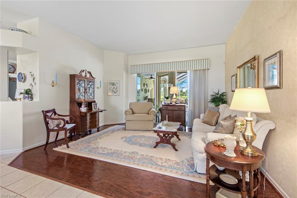 21516 Langholm Run Estero, FL 33928 - Photo 2 of 50 a living room with furniture and wooden floor