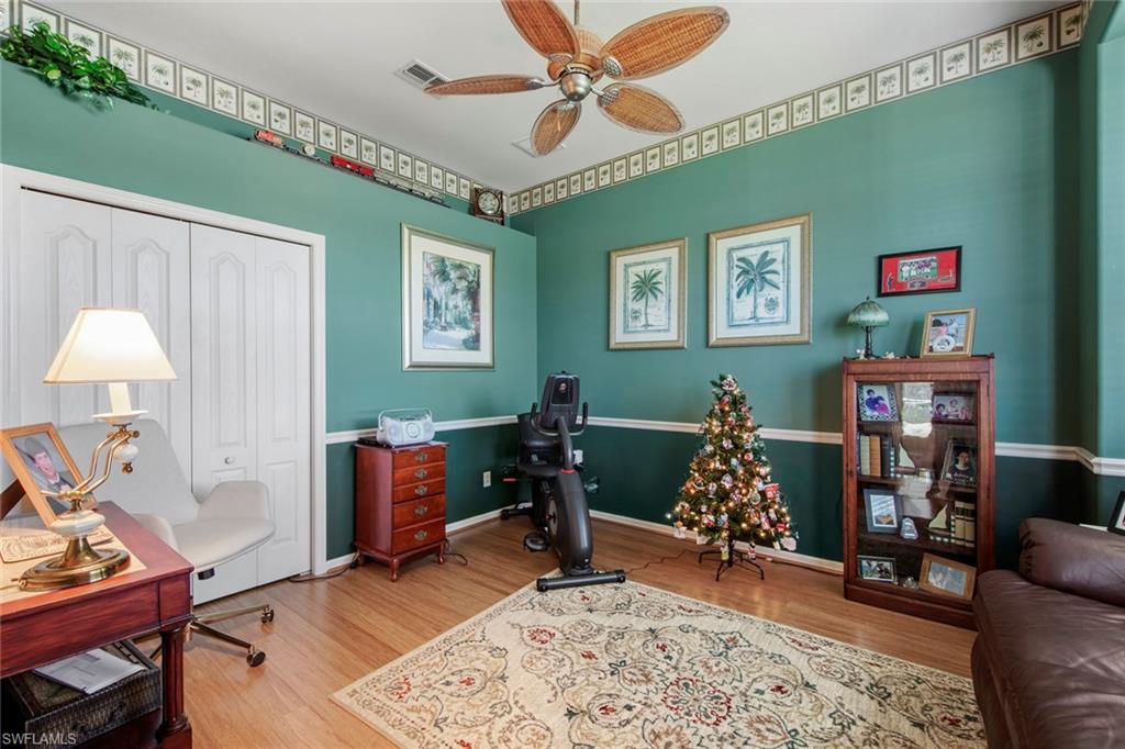 21516 Langholm Run Estero, FL 33928 - Photo 26 of 50 a bed room with furniture and a window