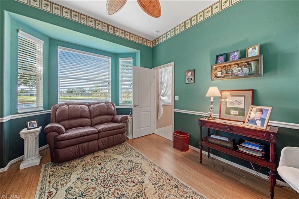 21516 Langholm Run Estero, FL 33928 - Photo 27 of 50 a living room with furniture and a window