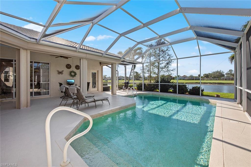 21516 Langholm Run Estero, FL 33928 - Photo 29 of 50 a view of a swimming pool with a patio