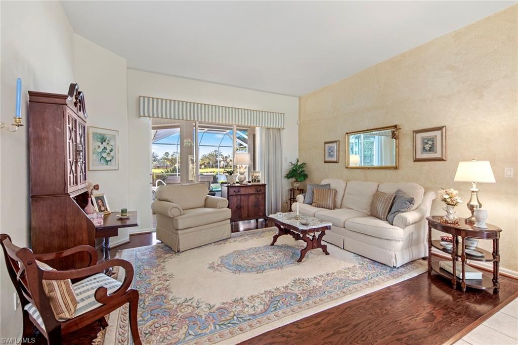 21516 Langholm Run Estero, FL 33928 - Photo 3 of 50 a living room with furniture and a large window