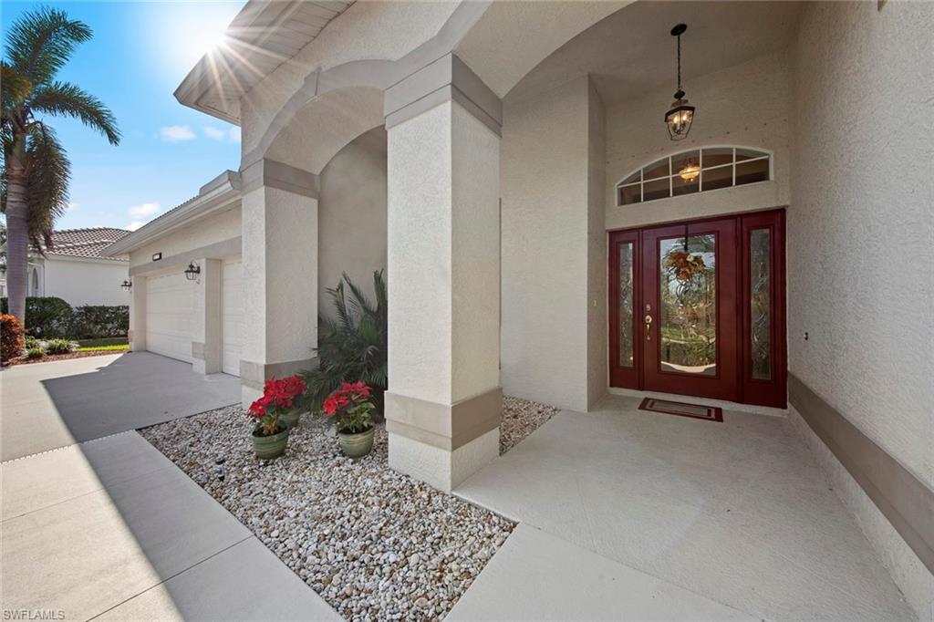 21516 Langholm Run Estero, FL 33928 - Photo 39 of 50 a front view of a house with entryway