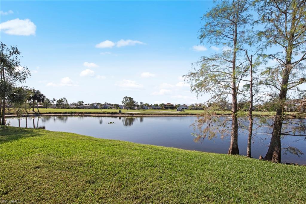 21516 Langholm Run Estero, FL 33928 - Photo 41 of 50 a view of lake with green space