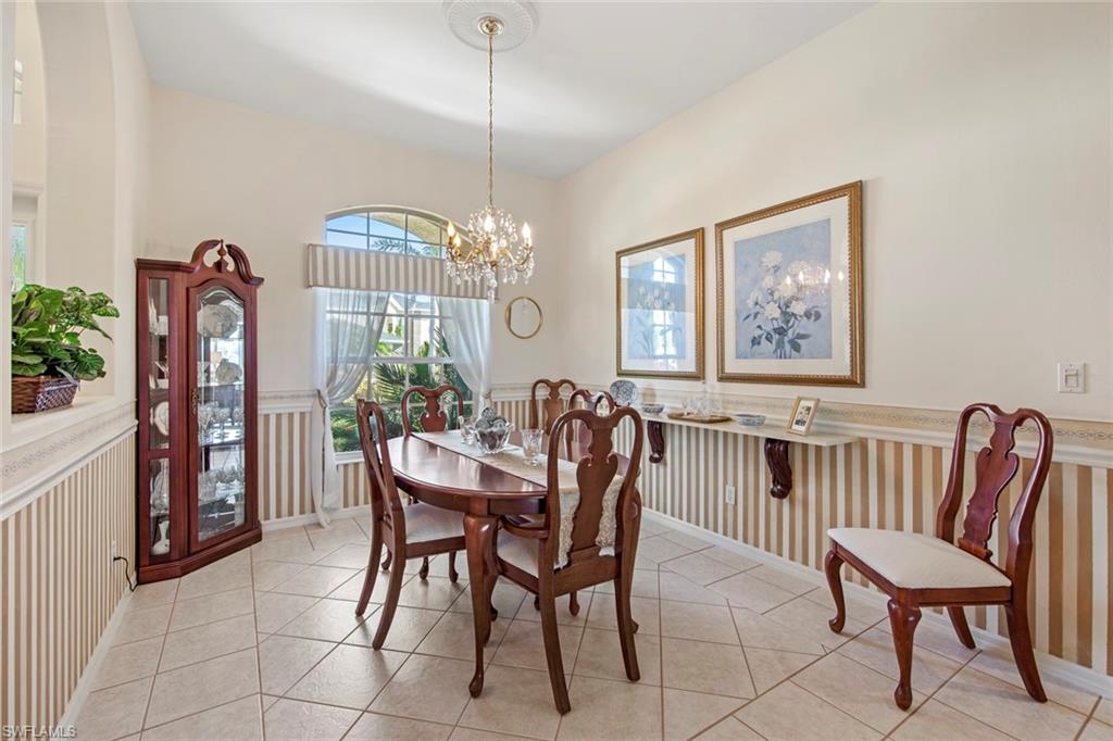 21516 Langholm Run Estero, FL 33928 - Photo 5 of 50 a view of a dining room with furniture window and wooden floor