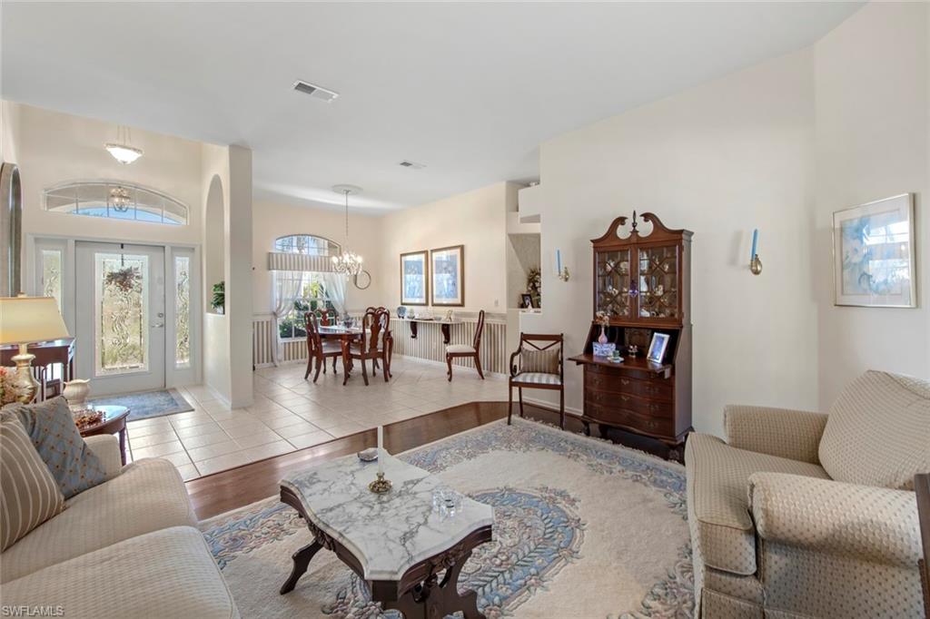 21516 Langholm Run Estero, FL 33928 - Photo 7 of 50 a living room with furniture and a table
