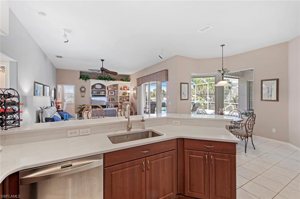 21516 Langholm Run Estero, FL 33928 - Photo 8 of 50 a kitchen with sink and window